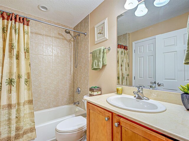 516 Tamiami Trl S Unit 303, Nokomis, FL 34275 - bathroom with a textured ceiling, shower / bath combo, and vanity