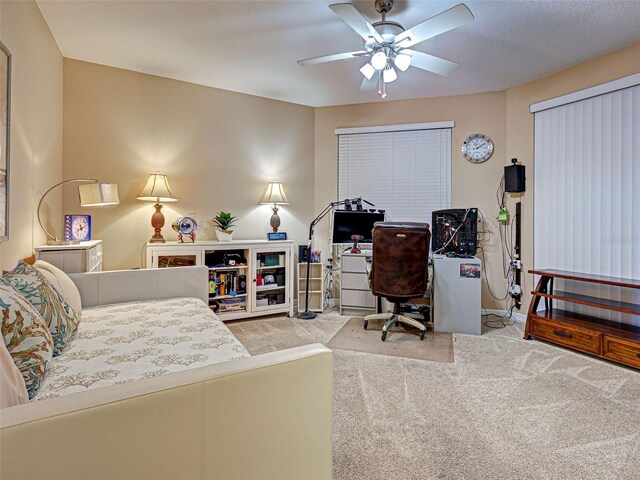 516 Tamiami Trl S Unit 303, Nokomis, FL 34275 - carpeted bedroom featuring baseboards and ceiling fan