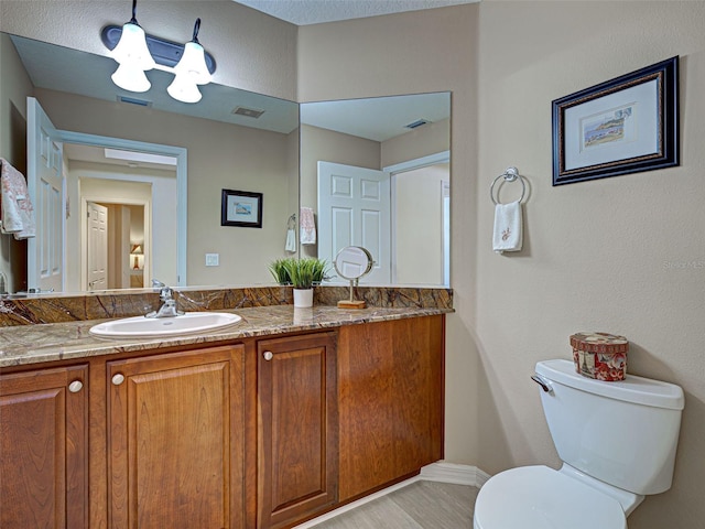 516 Tamiami Trl S Unit 303, Nokomis, FL 34275 - bathroom with toilet and vanity