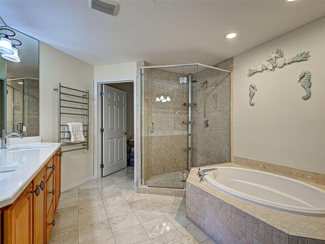 516 Tamiami Trl S Unit 303, Nokomis, FL 34275 - bathroom featuring a garden tub, a stall shower, double vanity, recessed lighting, and marble finish floors