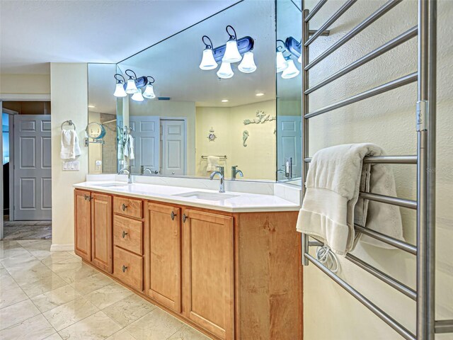 516 Tamiami Trl S Unit 303, Nokomis, FL 34275 - bathroom with double vanity and marble finish floors
