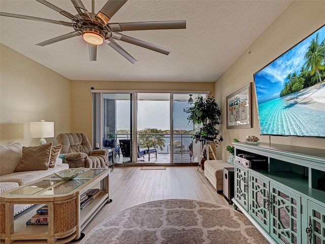 516 Tamiami Trl S Unit 303, Nokomis, FL 34275 - living area featuring wood finished floors and ceiling fan