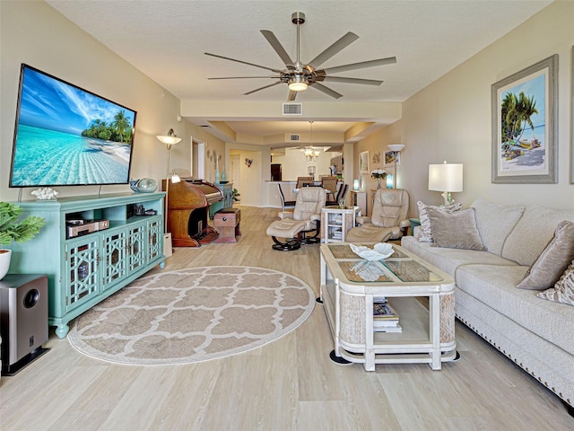 516 Tamiami Trl S Unit 303, Nokomis, FL 34275 - living area with wood finished floors and a ceiling fan