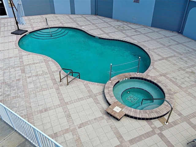 516 Tamiami Trl S Unit 303, Nokomis, FL 34275 - outdoor pool with a patio and an in-ground hot tub