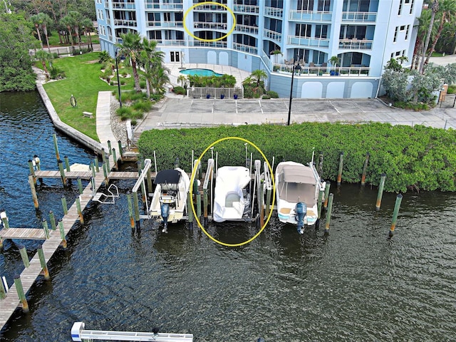 516 Tamiami Trl S Unit 303, Nokomis, FL 34275 - dock with a water view and boat lift