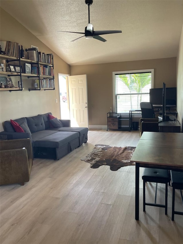 11248 Pendleton Ave Unit A & B, Englewood, FL 34224 - living area with lofted ceiling, ceiling fan, a textured ceiling, and wood finished floors
