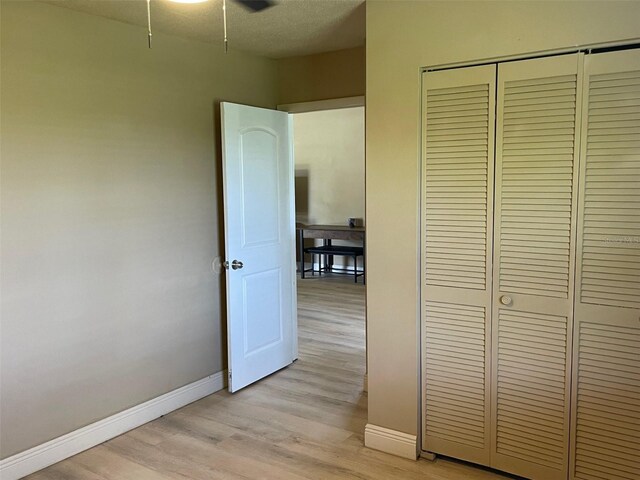 11248 Pendleton Ave Unit A & B, Englewood, FL 34224 - hallway featuring baseboards and light wood-style flooring