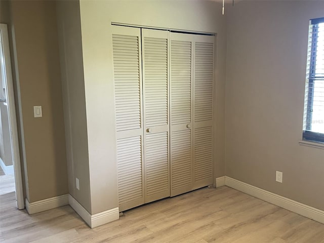 11248 Pendleton Ave Unit A & B, Englewood, FL 34224 - unfurnished bedroom with a closet, light wood-style floors, and baseboards