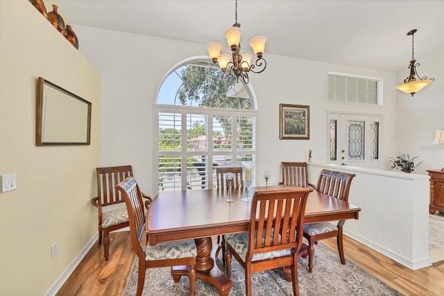 188 Grand Oak Cir, Venice, FL 34292 - dining space with a chandelier and light wood-style flooring