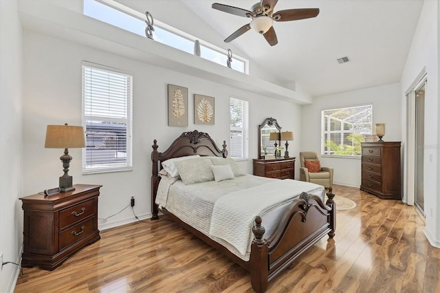 188 Grand Oak Cir, Venice, FL 34292 - bedroom featuring light wood-type flooring, high vaulted ceiling, and a ceiling fan