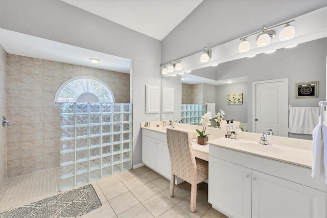 188 Grand Oak Cir, Venice, FL 34292 - full bath featuring double vanity, a walk in shower, tile patterned flooring, and vaulted ceiling