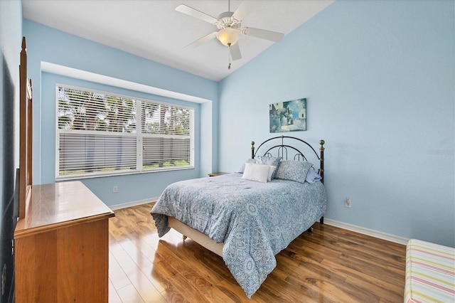 188 Grand Oak Cir, Venice, FL 34292 - bedroom with wood finished floors, lofted ceiling, and a ceiling fan