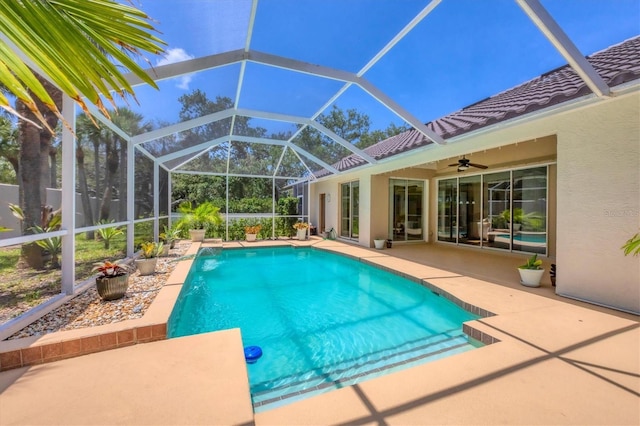 188 Grand Oak Cir, Venice, FL 34292 - outdoor pool featuring a patio area, ceiling fan, and glass enclosure