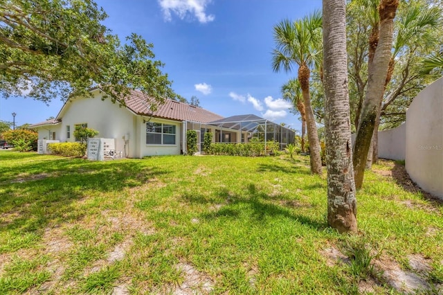 188 Grand Oak Cir, Venice, FL 34292 - view of grassy yard featuring a lanai