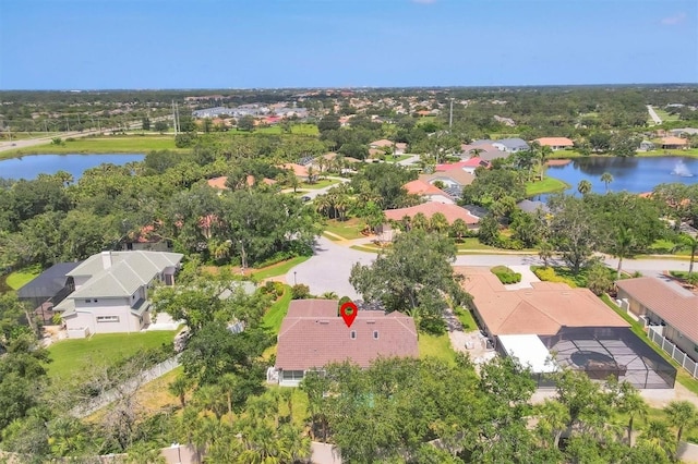188 Grand Oak Cir, Venice, FL 34292 - aerial view of residential area with a large body of water and a tree filled landscape