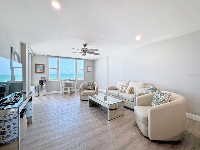 1100 Tarpon Center Dr Unit 503-5C, Venice, FL 34285 - living room featuring baseboards, light wood finished floors, a ceiling fan, and recessed lighting