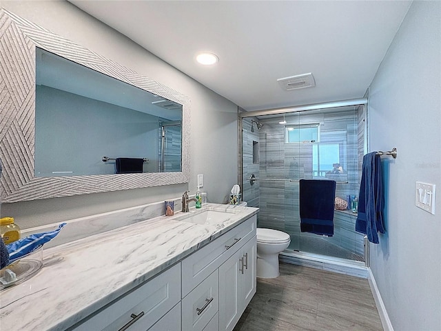 1100 Tarpon Center Dr Unit 503-5C, Venice, FL 34285 - bathroom with toilet, vanity, a shower stall, and baseboards