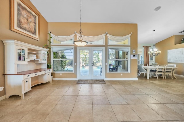 249 Hallcrest Ter, Port Charlotte, FL 33954 - dining space with a chandelier, light tile patterned flooring, baseboards, and lofted ceiling