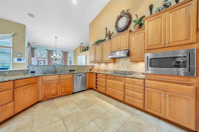 249 Hallcrest Ter, Port Charlotte, FL 33954 - kitchen with stainless steel appliances, a sink, under cabinet range hood, decorative backsplash, and a chandelier