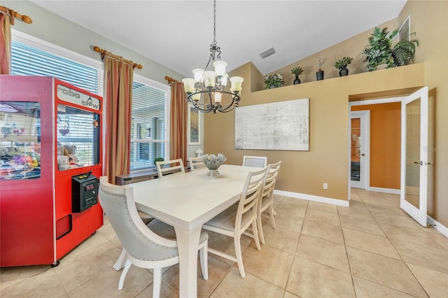 249 Hallcrest Ter, Port Charlotte, FL 33954 - dining area featuring a chandelier, vaulted ceiling, light tile patterned flooring, baseboards, and french doors