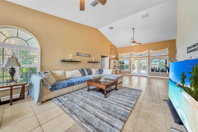 249 Hallcrest Ter, Port Charlotte, FL 33954 - living area featuring ceiling fan, high vaulted ceiling, healthy amount of natural light, tile patterned flooring, and french doors