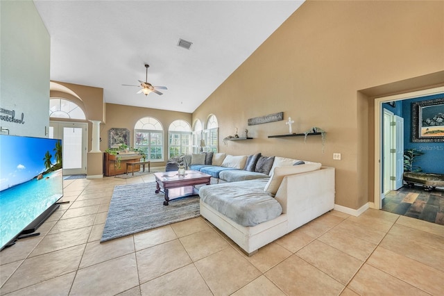 249 Hallcrest Ter, Port Charlotte, FL 33954 - living room featuring high vaulted ceiling, light tile patterned floors, ceiling fan, and baseboards