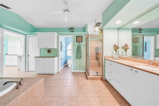 249 Hallcrest Ter, Port Charlotte, FL 33954 - bathroom featuring vanity, a stall shower, a ceiling fan, toilet, and a garden tub