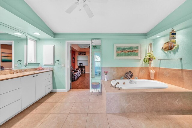 249 Hallcrest Ter, Port Charlotte, FL 33954 - full bath with a ceiling fan, vaulted ceiling, vanity, tile patterned flooring, and a garden tub