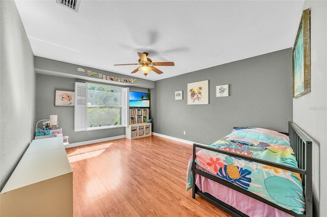 249 Hallcrest Ter, Port Charlotte, FL 33954 - bedroom with wood finished floors, ceiling fan, and baseboards