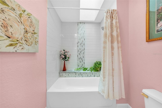 249 Hallcrest Ter, Port Charlotte, FL 33954 - bathroom with toilet, shower / tub combo with curtain, and a skylight