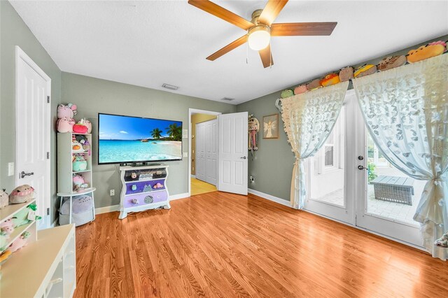 249 Hallcrest Ter, Port Charlotte, FL 33954 - living room featuring wood finished floors, a ceiling fan, and baseboards