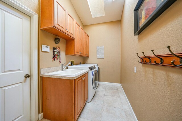 249 Hallcrest Ter, Port Charlotte, FL 33954 - washroom with cabinet space, baseboards, independent washer and dryer, a textured wall, and light tile patterned flooring