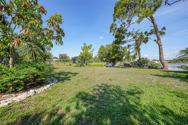 249 Hallcrest Ter, Port Charlotte, FL 33954 - view of green lawn with a water view