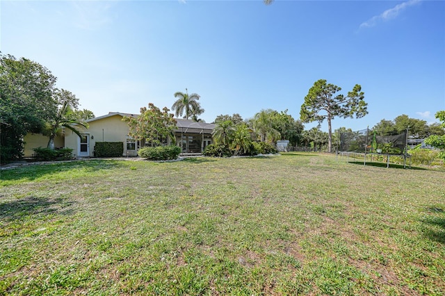249 Hallcrest Ter, Port Charlotte, FL 33954 - view of grassy yard featuring a trampoline