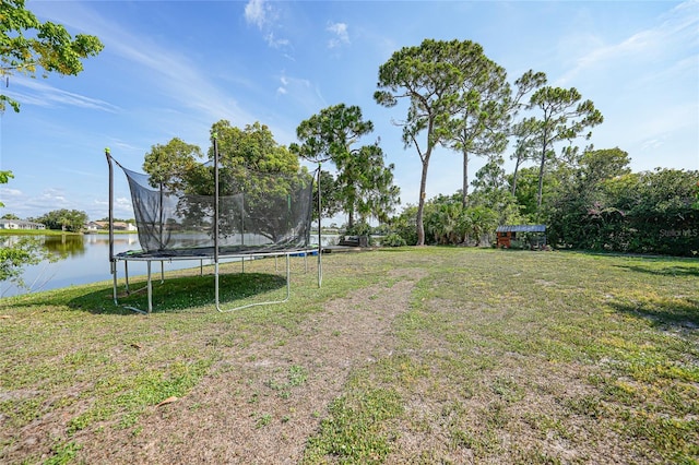 249 Hallcrest Ter, Port Charlotte, FL 33954 - view of grassy yard featuring a trampoline and a water view