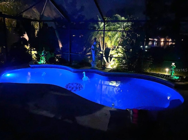249 Hallcrest Ter, Port Charlotte, FL 33954 - pool at night featuring an outdoor pool and a lanai