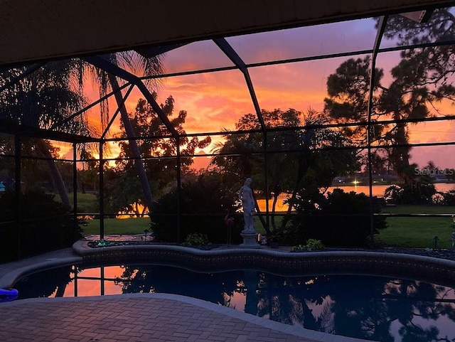 249 Hallcrest Ter, Port Charlotte, FL 33954 - pool at dusk with glass enclosure, an outdoor pool, and a patio area