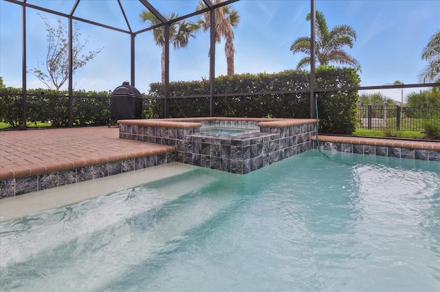 15336 Spanish Point Dr, Port Charlotte, FL 33981 - view of pool with glass enclosure, a patio, and a pool with connected hot tub