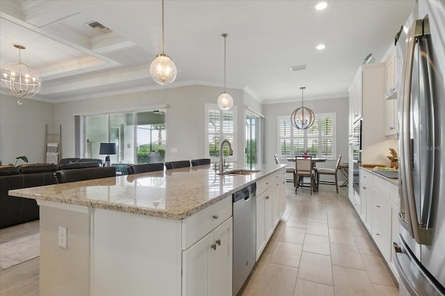 15336 Spanish Point Dr, Port Charlotte, FL 33981 - kitchen featuring appliances with stainless steel finishes, a chandelier, a kitchen island with sink, crown molding, and recessed lighting