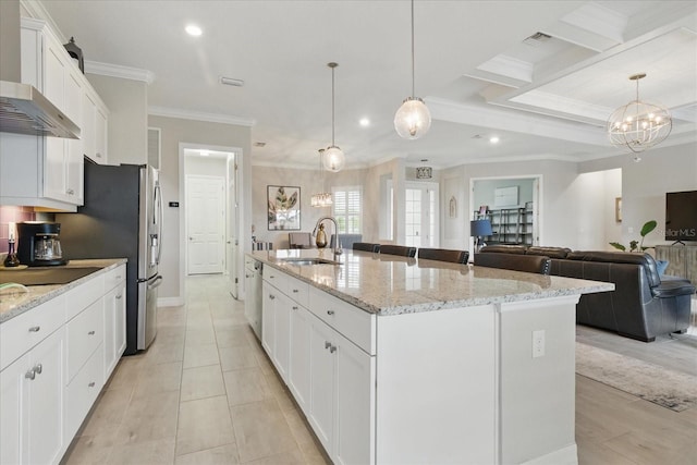15336 Spanish Point Dr, Port Charlotte, FL 33981 - kitchen featuring ornamental molding, recessed lighting, wall chimney exhaust hood, open floor plan, and white cabinetry