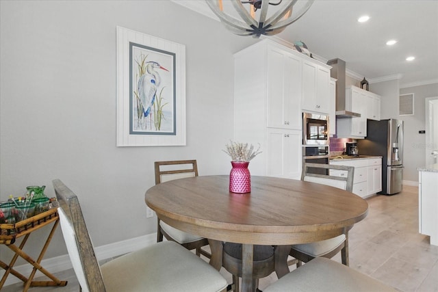 15336 Spanish Point Dr, Port Charlotte, FL 33981 - dining space with crown molding and recessed lighting