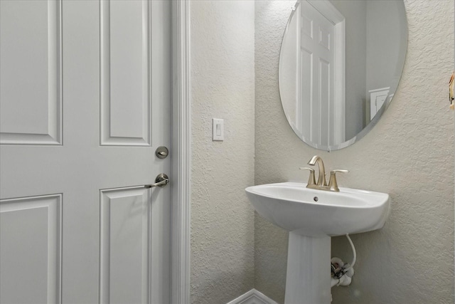 15336 Spanish Point Dr, Port Charlotte, FL 33981 - bathroom with a textured wall and a sink