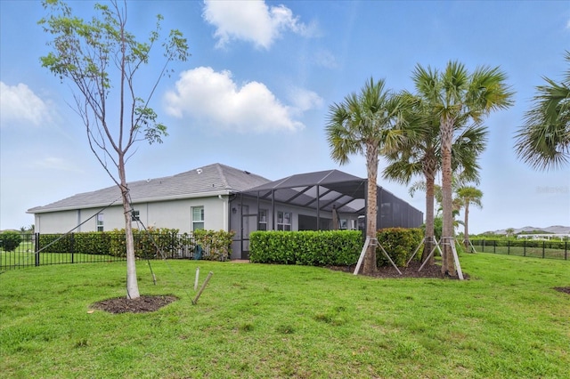 15336 Spanish Point Dr, Port Charlotte, FL 33981 - rear view of property with glass enclosure and stucco siding