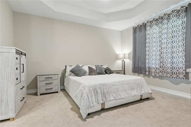 15963 Crofton Springs Way, Port Charlotte, FL 33953 - bedroom featuring light colored carpet, baseboards, and a tray ceiling