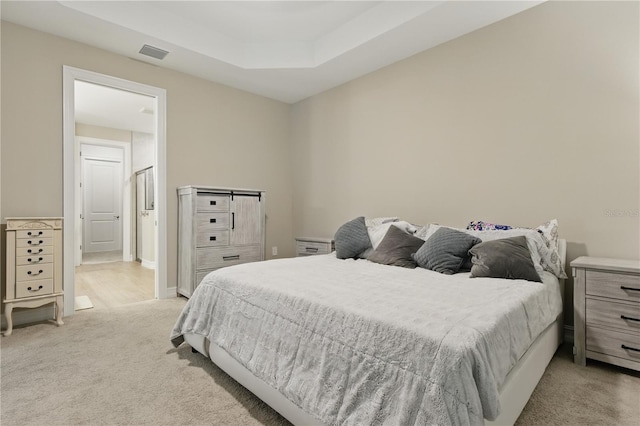 15963 Crofton Springs Way, Port Charlotte, FL 33953 - bedroom featuring light carpet and a tray ceiling