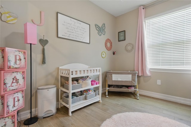 15963 Crofton Springs Way, Port Charlotte, FL 33953 - bedroom featuring wood finished floors and baseboards