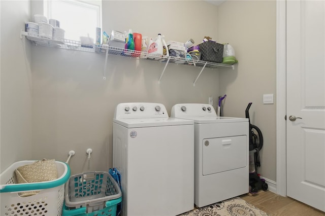 15963 Crofton Springs Way, Port Charlotte, FL 33953 - laundry room featuring independent washer and dryer and light wood finished floors