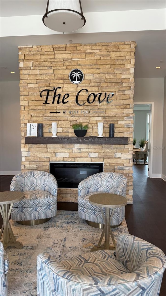 15963 Crofton Springs Way, Port Charlotte, FL 33953 - sitting room with a fireplace, baseboards, wood finished floors, and recessed lighting
