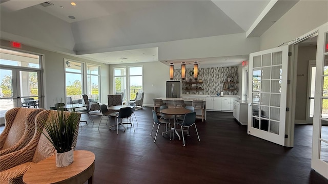 15963 Crofton Springs Way, Port Charlotte, FL 33953 - dining space with french doors, vaulted ceiling, dark wood-style floors, recessed lighting, and baseboards