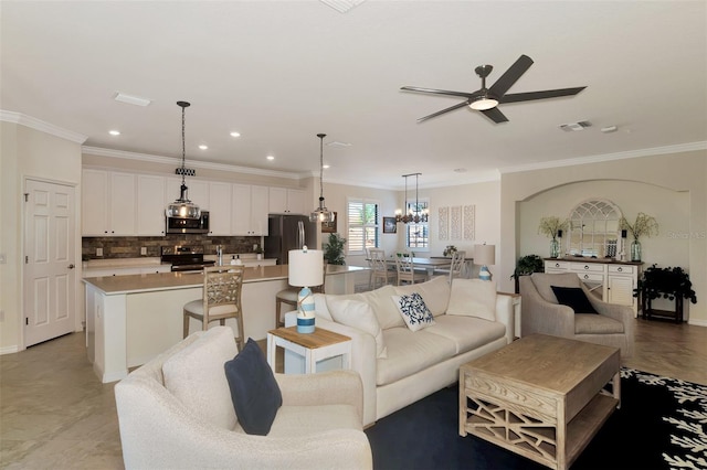 10789 Tarflower Dr Unit 202, Venice, FL 34293 - living room with ceiling fan, crown molding, recessed lighting, and a chandelier